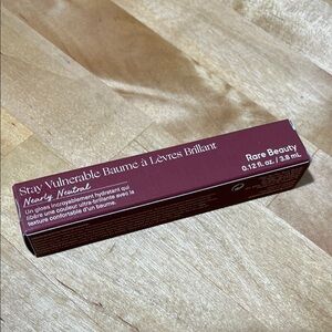 New Rare Beauty stay vulnerable glossy lip balm in nearly neutral rare beauty
